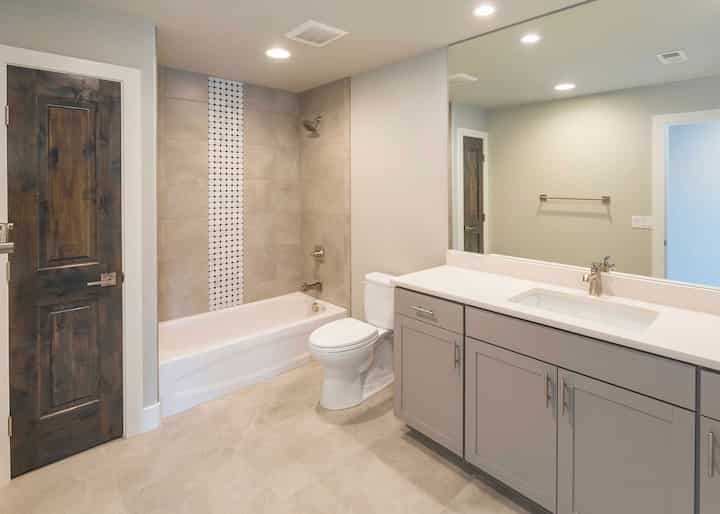 A new bathtub and shower installation adds functionality to this bathroom in a Monterey Park, CA home.